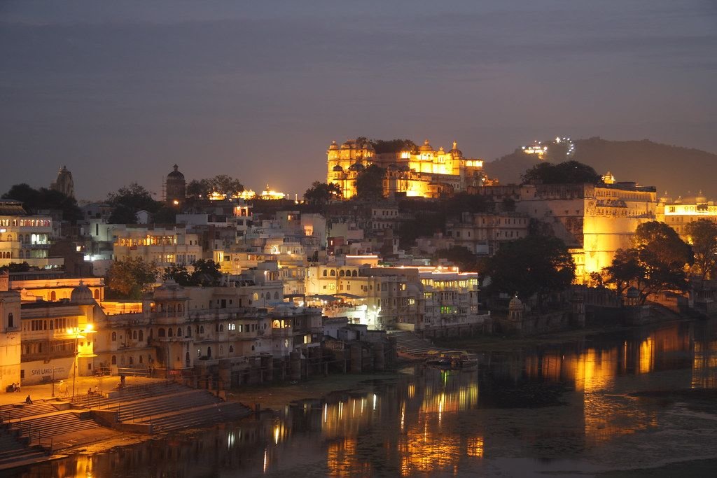 City Palace lit up at night over Lake Pichola, Udaipur